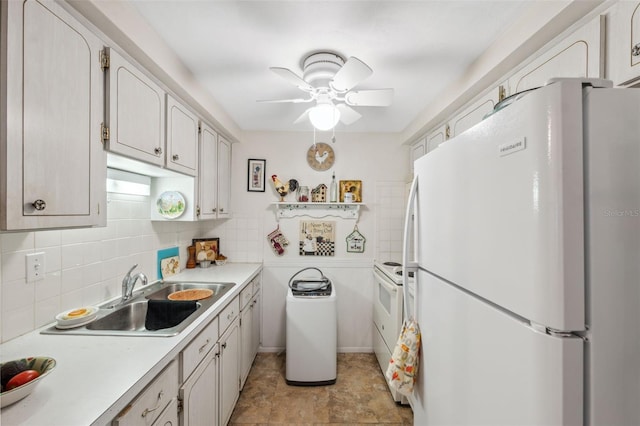 kitchen with white appliances, a sink, a ceiling fan, light countertops, and tasteful backsplash