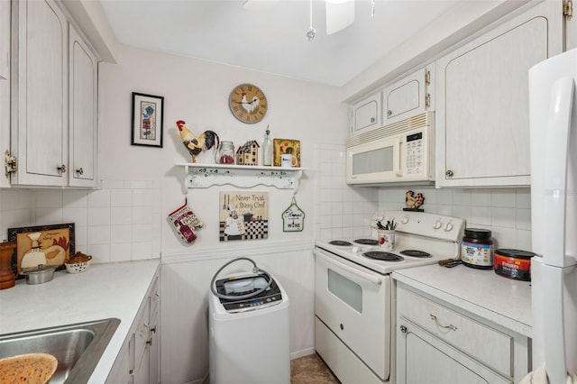 kitchen featuring a ceiling fan, white appliances, light countertops, and backsplash