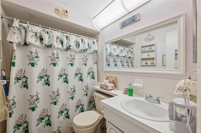 bathroom featuring toilet, tasteful backsplash, a shower with shower curtain, and vanity