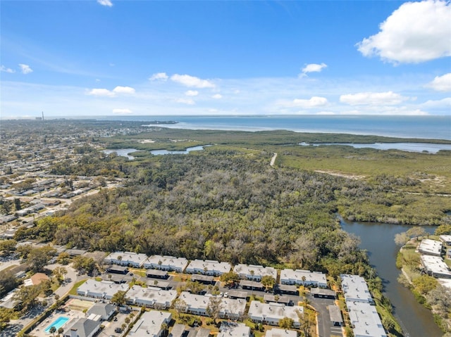 drone / aerial view featuring a residential view and a water view