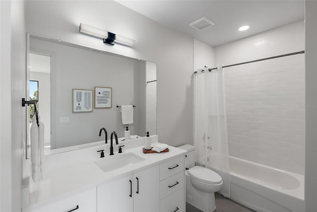 bathroom with toilet, shower / bath combo, vanity, and visible vents