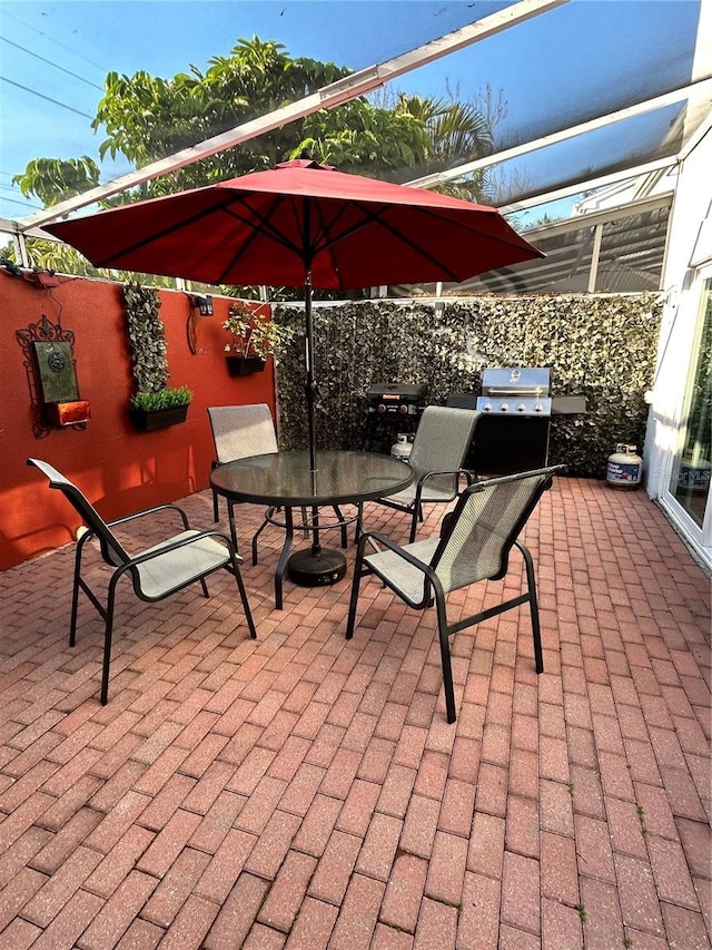 view of patio with outdoor dining space and grilling area