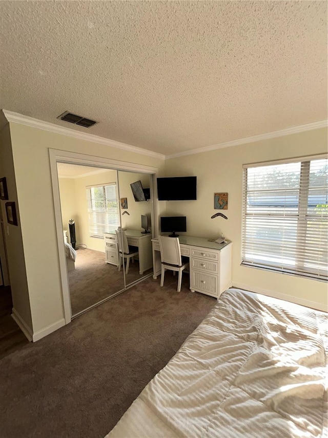 bedroom featuring visible vents, dark carpet, and ornamental molding