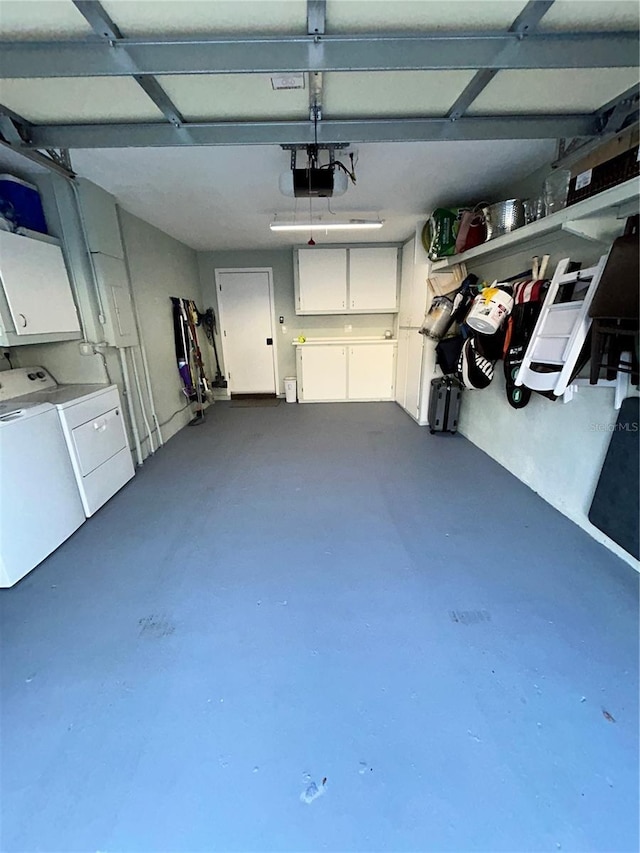 garage featuring a garage door opener and washer and clothes dryer