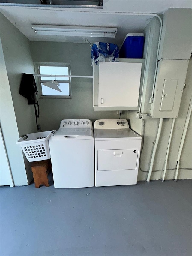 laundry area with washer and dryer and cabinet space