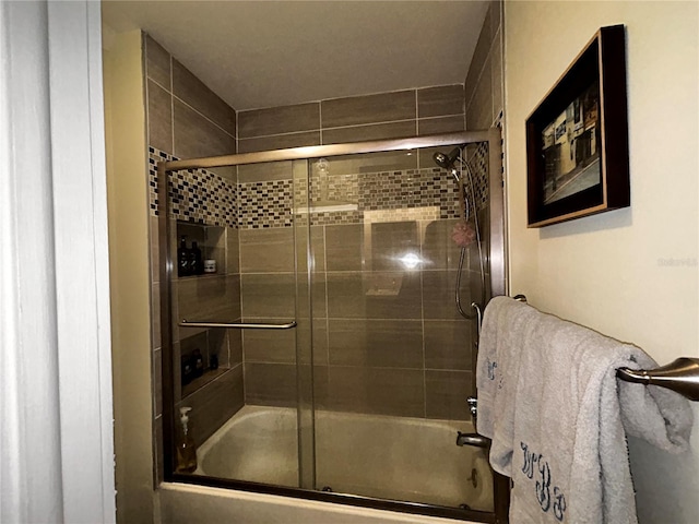 full bathroom with shower / bath combination with glass door