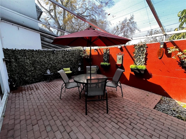 view of patio / terrace with outdoor dining area and a fenced backyard