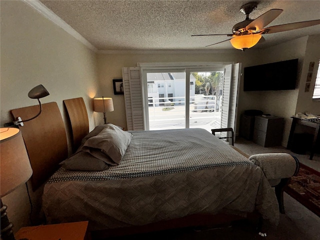 bedroom with access to exterior, crown molding, carpet floors, a textured ceiling, and a ceiling fan