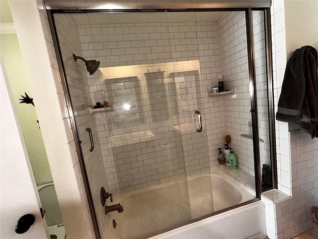 full bathroom featuring shower / bath combination with glass door