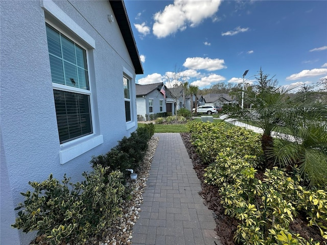 view of property exterior featuring a residential view and stucco siding