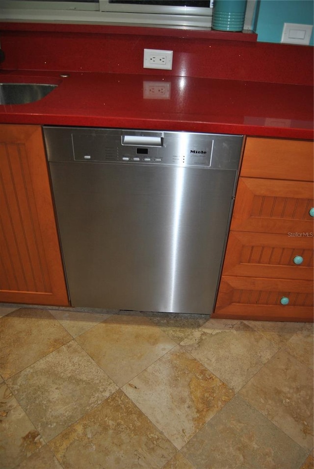 interior details featuring a sink and dishwasher