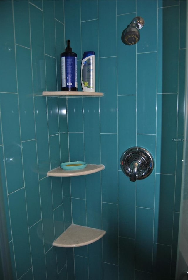 bathroom with a tile shower