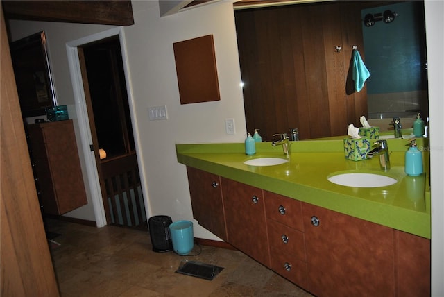 bathroom with double vanity and a sink