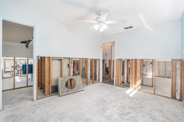 spare room featuring ceiling fan and visible vents