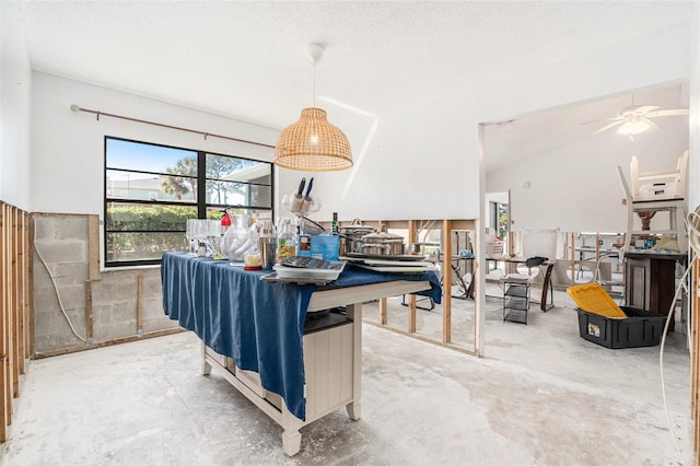 kitchen with concrete flooring and a textured ceiling