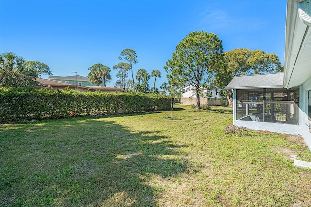 view of yard featuring a sunroom