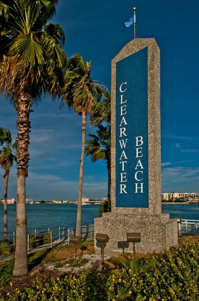 community sign with a water view