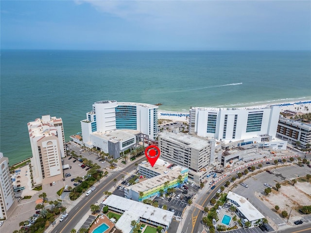 birds eye view of property with a water view and a view of city