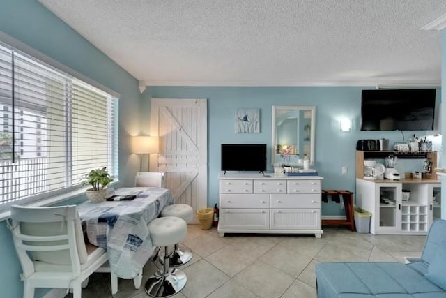 living area with light tile patterned flooring and a textured ceiling