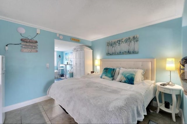tiled bedroom with ornamental molding and baseboards
