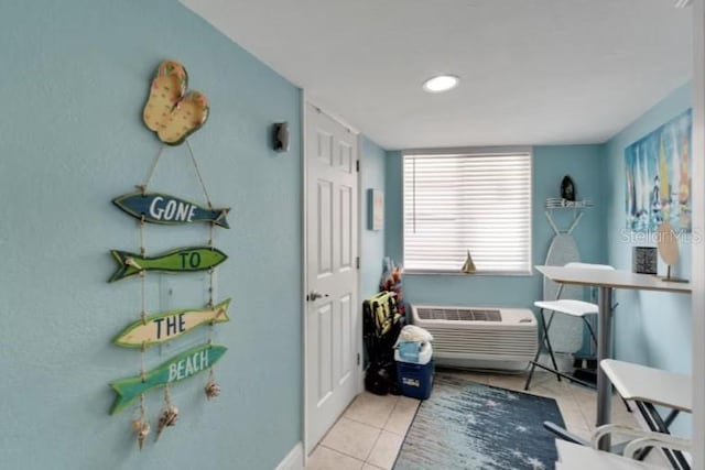 tiled bedroom with an AC wall unit
