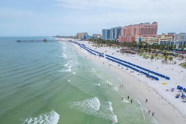 property view of water featuring a beach view and a city view