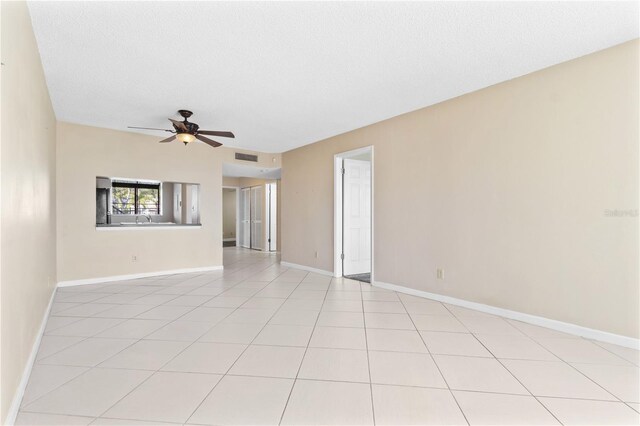 2073 Skimmer Ct W Unit 211, Clearwater, FL 33762 - spare room with light tile patterned floors, ceiling fan, visible vents, and baseboards