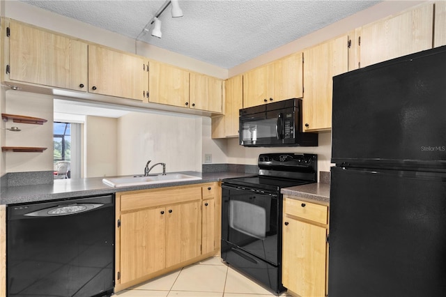 2073 Skimmer Ct W Unit 211, Clearwater, FL 33762 - kitchen with black appliances and light brown cabinets