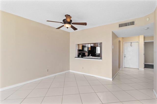 2073 Skimmer Ct W Unit 211, Clearwater, FL 33762 - empty room with visible vents, a textured ceiling, ceiling fan, and baseboards