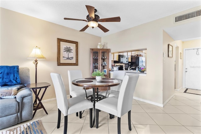 2073 Skimmer Ct W Unit 211, Clearwater, FL 33762 - dining space featuring visible vents, a ceiling fan, baseboards, and light tile patterned floors