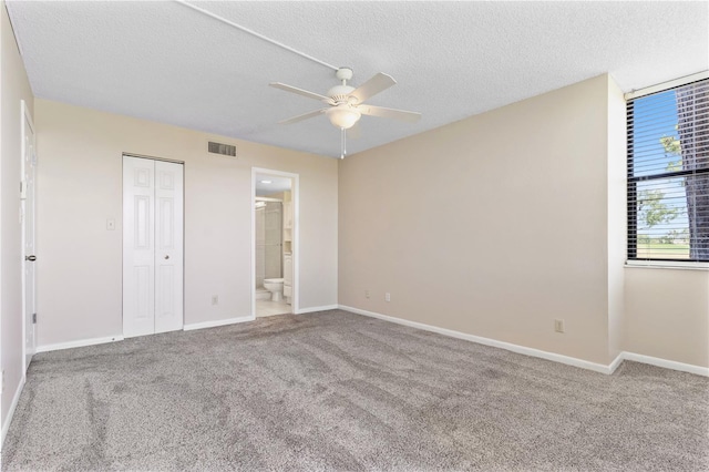 2073 Skimmer Ct W Unit 211, Clearwater, FL 33762 - unfurnished bedroom featuring baseboards, carpet flooring, a textured ceiling, and visible vents