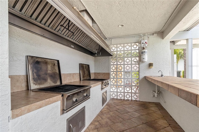 2073 Skimmer Ct W Unit 211, Clearwater, FL 33762 - view of patio featuring exterior kitchen and area for grilling