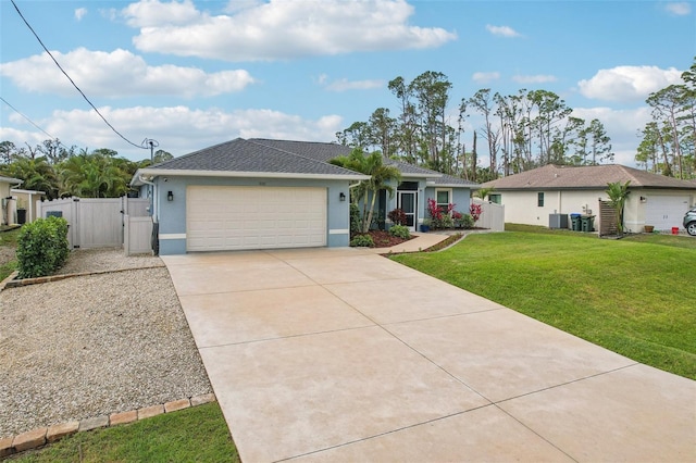 ranch-style home featuring an attached garage, driveway, a gate, stucco siding, and a front yard