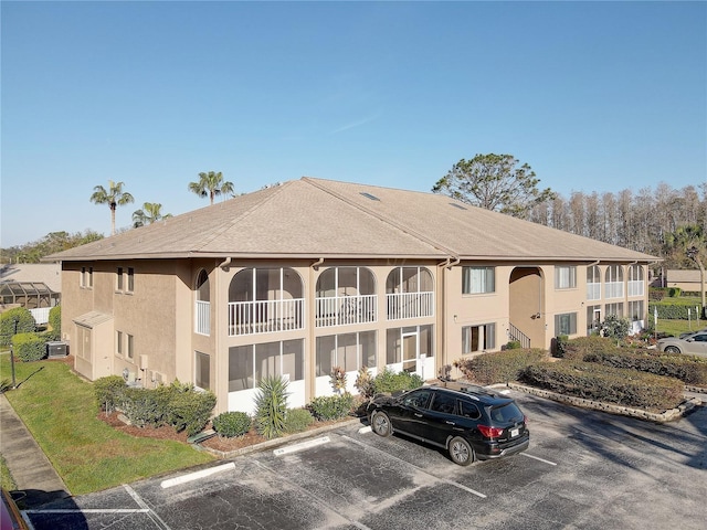 view of property featuring uncovered parking