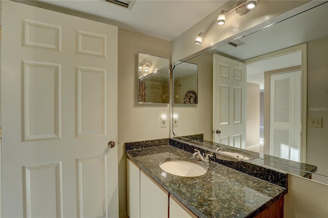 bathroom with visible vents and vanity