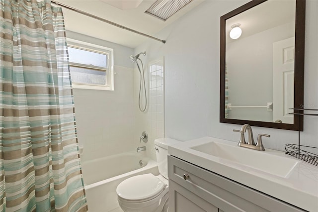 bathroom with toilet, vanity, shower / bath combo with shower curtain, and visible vents