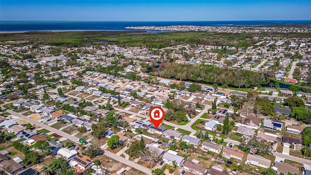 birds eye view of property featuring a residential view and a water view