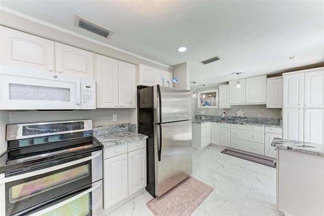 kitchen featuring marble finish floor, appliances with stainless steel finishes, visible vents, and white cabinets