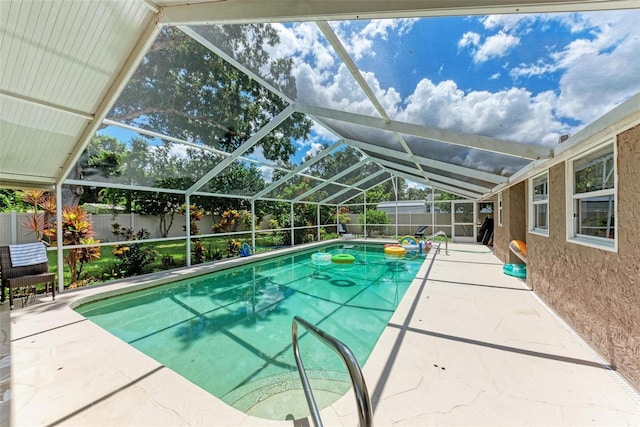 view of pool with a lanai, a fenced backyard, a fenced in pool, and a patio