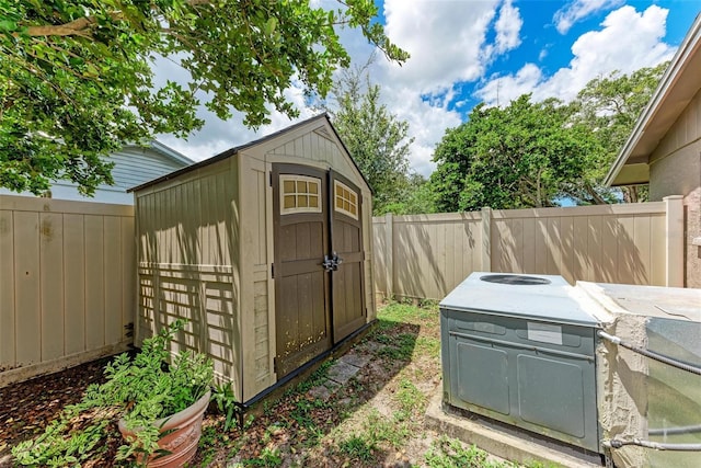 view of shed with a fenced backyard