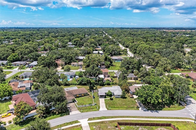 aerial view featuring a residential view and a forest view