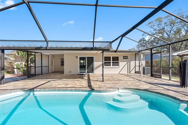 outdoor pool featuring a lanai and a patio