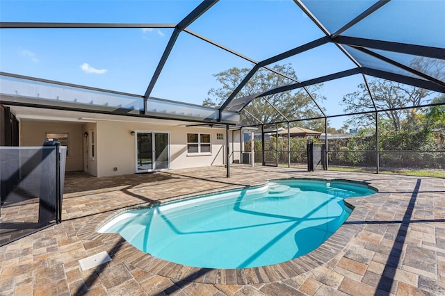 outdoor pool with a patio and a lanai