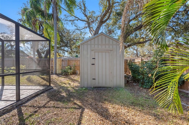 view of shed with a fenced backyard