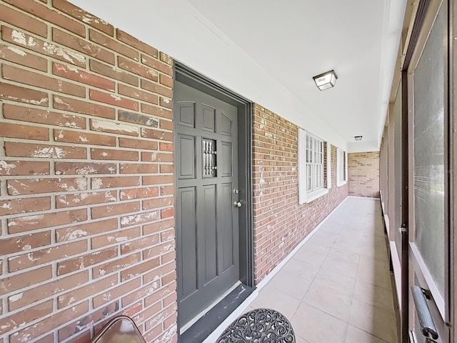 property entrance with brick siding