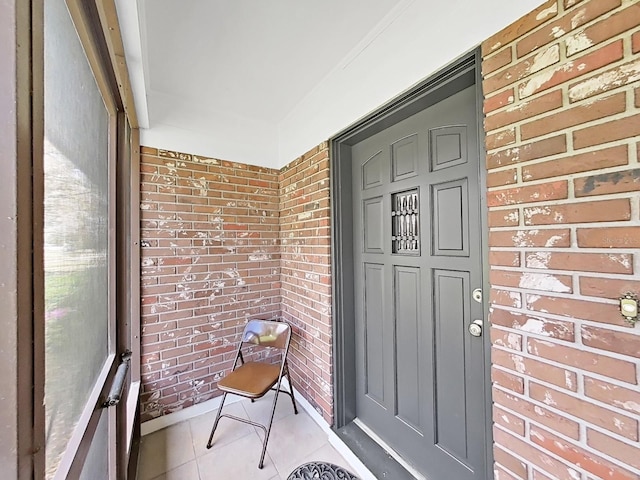 property entrance with brick siding