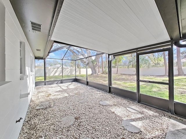 unfurnished sunroom with visible vents and a wealth of natural light