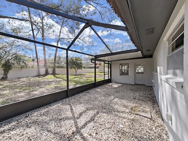 unfurnished sunroom with visible vents