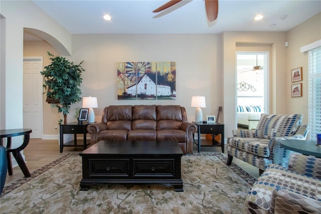 328 Siena Vista Pl, Sun City Center, FL 33573 - living room with baseboards, arched walkways, a ceiling fan, light wood-style flooring, and recessed lighting