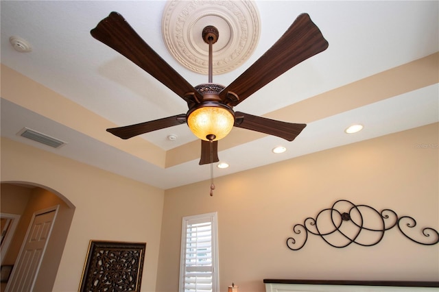 328 Siena Vista Pl, Sun City Center, FL 33573 - room details with arched walkways, ceiling fan, recessed lighting, visible vents, and a tray ceiling